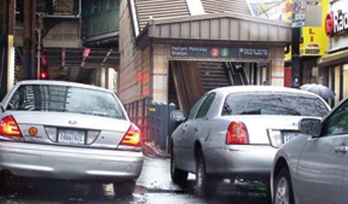WP Rd TLC cars block shoppers
