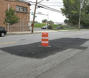 DOT fills street “cave in”