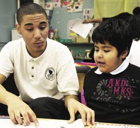 First grade readers, teen tutors, go one-on-one