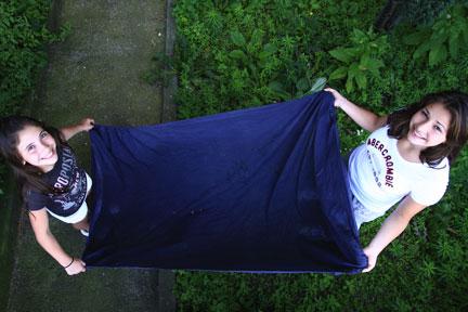 Pelham Bay girls rescue scaredy cat from 2nd floor perch