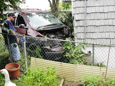 Car hits house