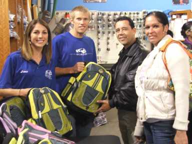 Top runner distributes school supplies