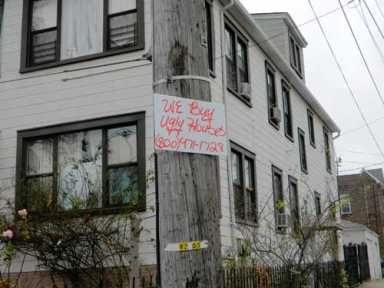 Illegal postings placed throughout Community Board 11