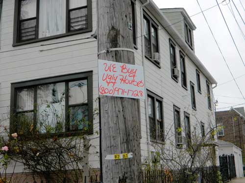 Illegal postings placed throughout Community Board 11
