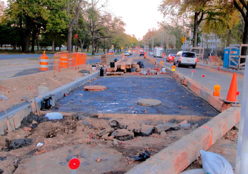 Sidewalk along Pelham Parkway south carved in concrete, as construction project continues