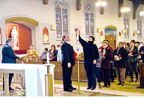 Annual mass shines light on lost loved ones