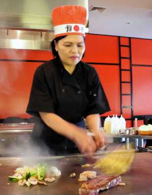 Lady chef manning hibachi grill at City Island’s Ohana|Lady chef manning hibachi grill at City Island’s Ohana