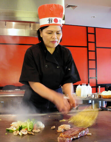 Lady chef manning hibachi grill at City Island’s Ohana|Lady chef manning hibachi grill at City Island’s Ohana