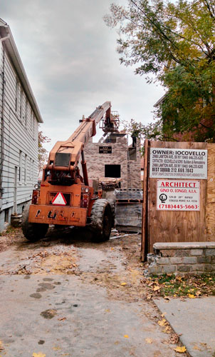 Construction of Throggs Neck thin house back in motion