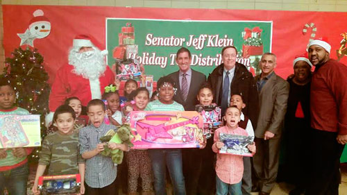 Klein hands out toys at TNHouses