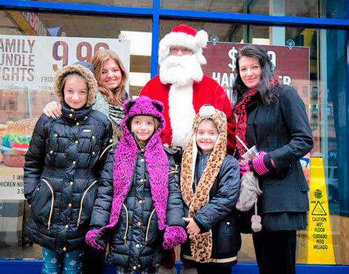 The White Plains Road Business Improvement District has Santa Claus on the street during holidays