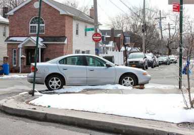 Wrong No Standing Anytime sign at Rawlins and Kearney avenues traffic triangle