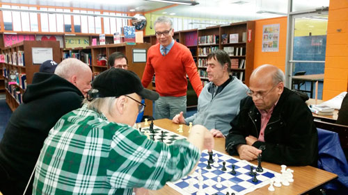 Councilman visits library and obverses chess match