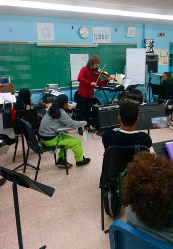 Violinist Alexander Markov performs at Celia Cruz