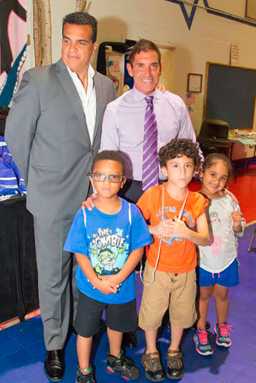 Klein donates summer backpacks to local children