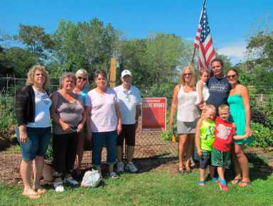 Community gardeners in Edgewater Park open straw-bale garden|Community gardeners in Edgewater Park open straw-bale garden|Community gardeners in Edgewater Park open straw-bale garden