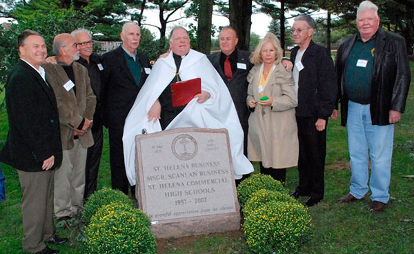 Stone dedication held by St. Helena at Monsignor