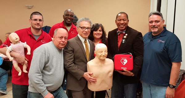 King Presents Defibrillators To Community Groups