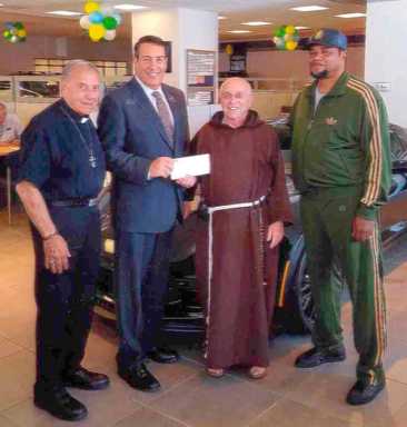 La Sorsa Presents Check to Fr. Aurilia