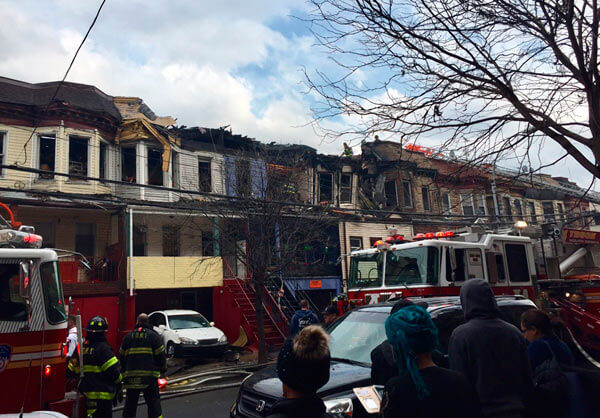 Row house fire displaces 26 residents|Row house fire displaces 26 residents
