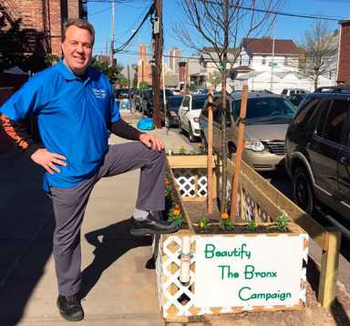 PB shop owner beautifies sidewalk tree|PB shop owner beautifies sidewalk tree