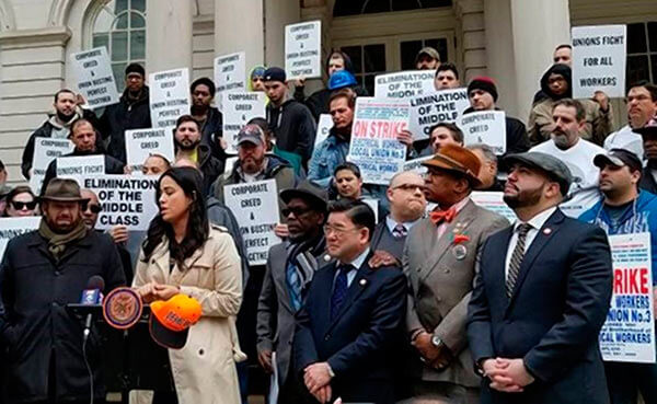 King Denounces Unfair Labor Practices