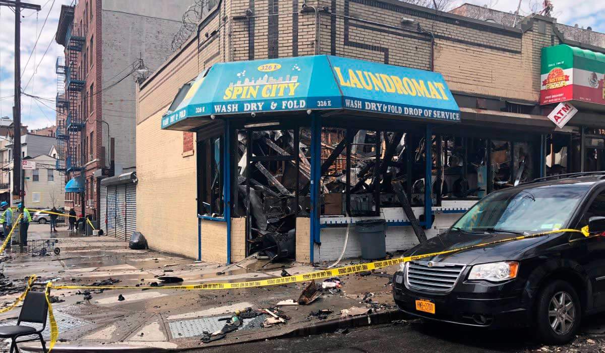 Five alarm fire destroys Bedford Park commercial strip
