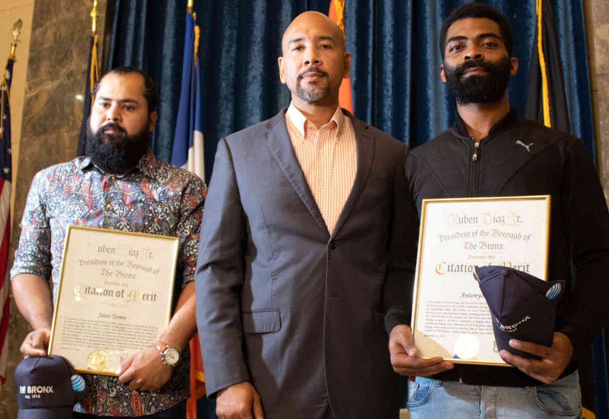 Two men who saved girl from subway are honored by Diaz