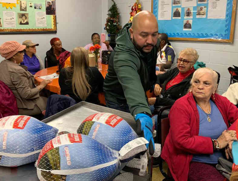 Diaz, Salamanca hand out turkeys at Melrose Senior Center
