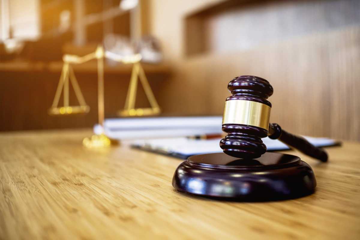 image of justice hammer in law firm office.