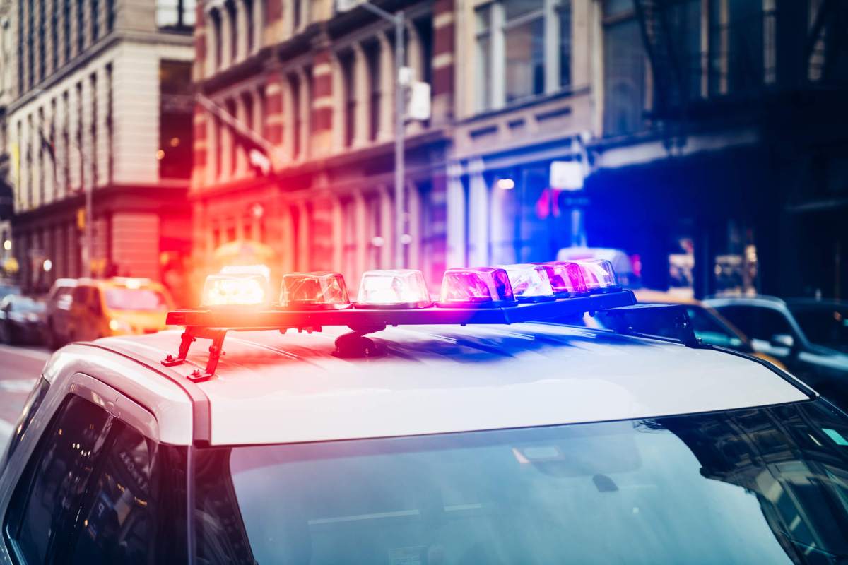 Police car with alarm and signal light flashes on the roof rush emergency call in New York City