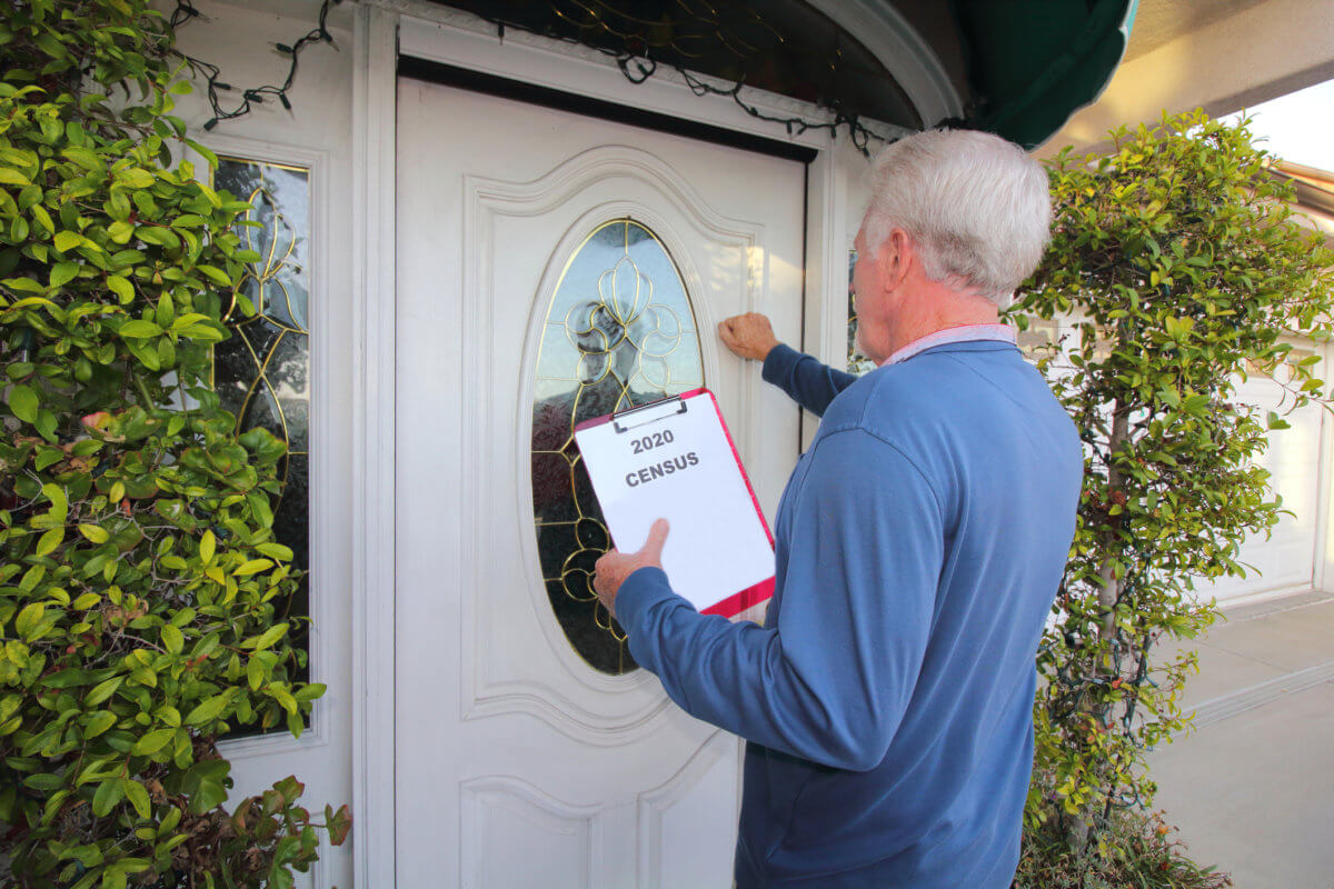 Man Canvassing Door to Door for the 2020 Census