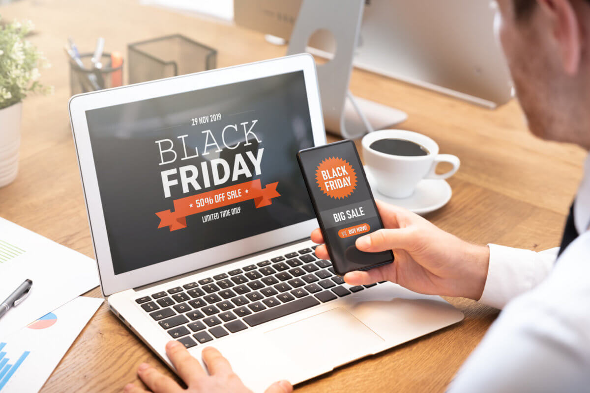 Black Friday sale on laptop and phone screen