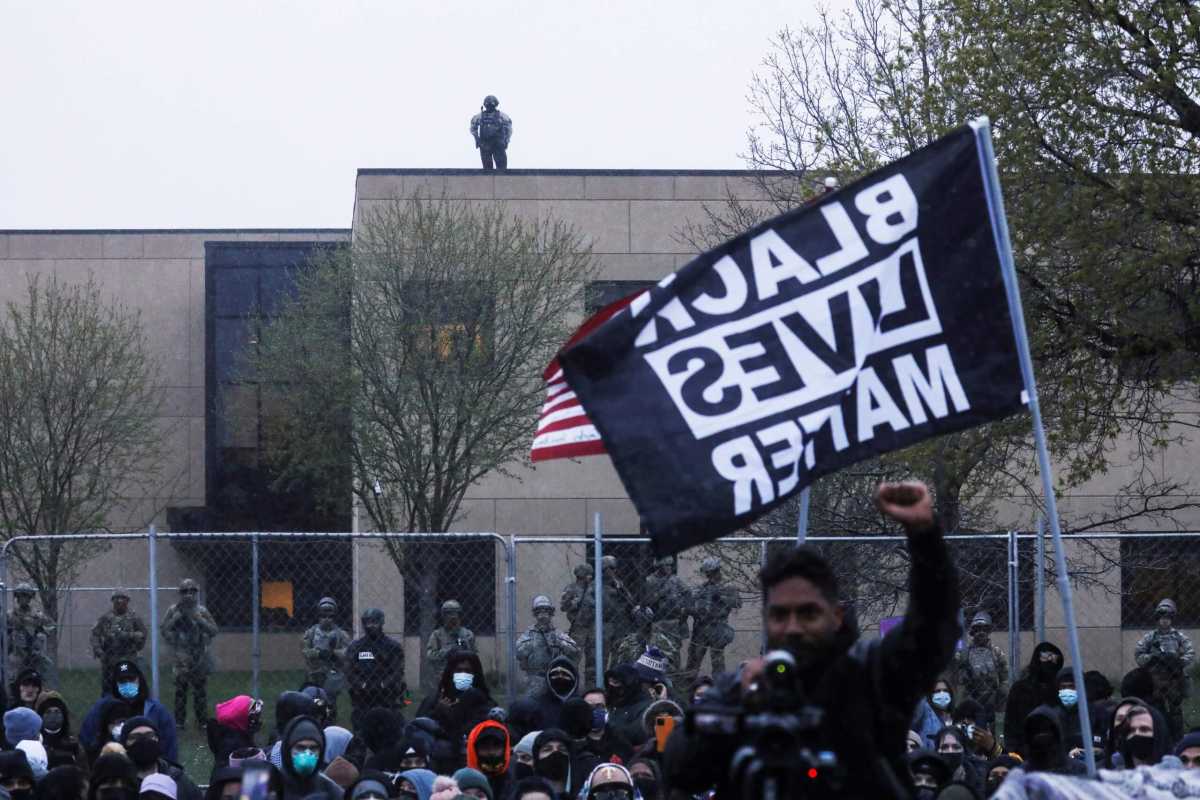 Protesters rally outside the Brooklyn Center Police Department, days after Daunte Wright was shot and killed by a police officer, in Brooklyn Center, Minnesota