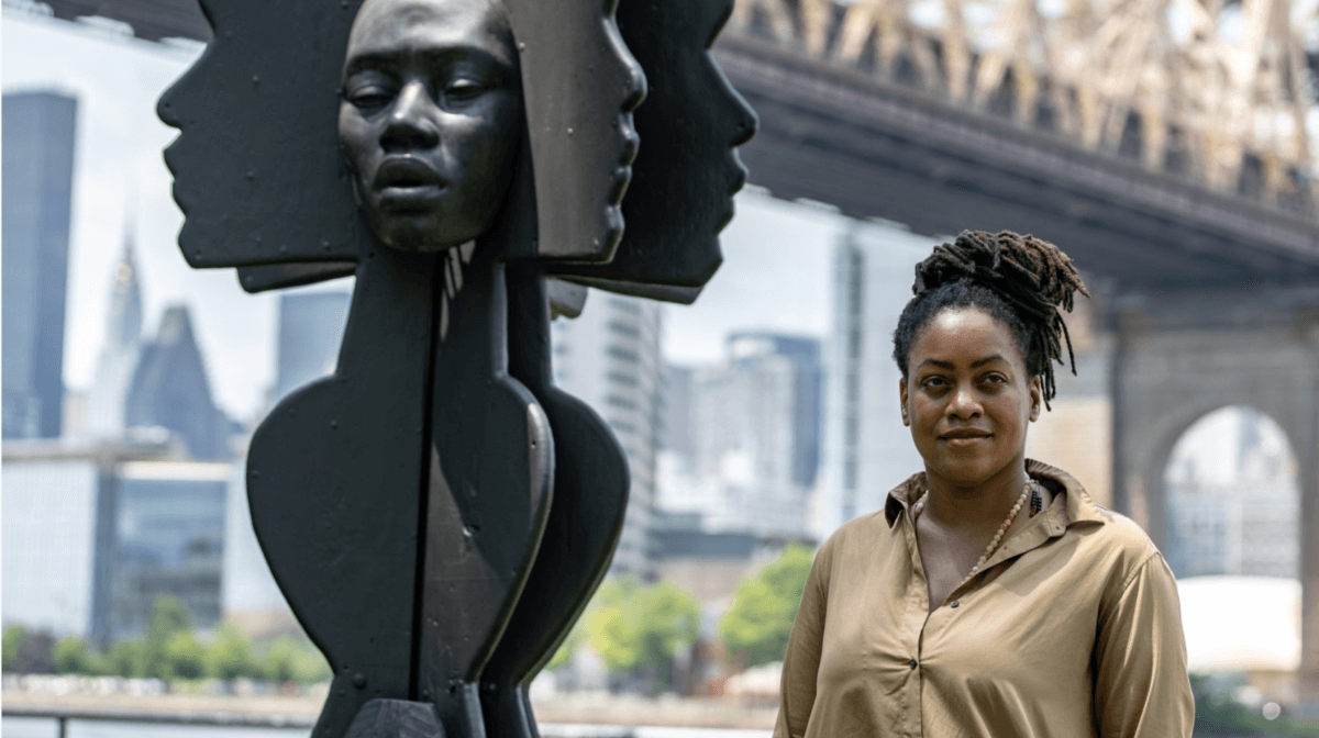 Artist Tanda Francis poses with her sculpture ‘Be Heard’ in Queensbridge Park, Queens borough of New York, U.S., July 16, 2021. REUTERS/Jeenah Moon