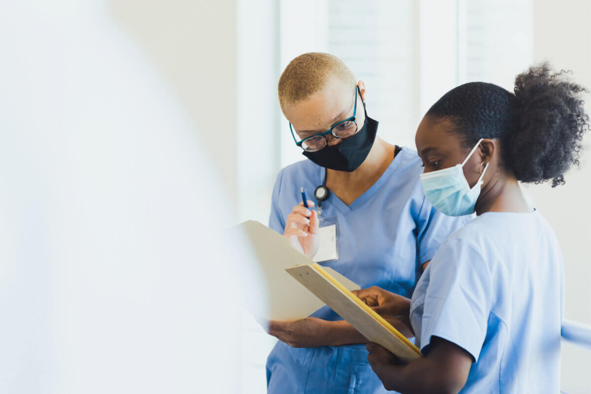 Serious doctors examine patient’s test results