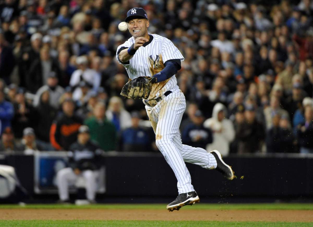 New York Yankees shortstop Jeter throws out Baltimore Orioles’ Hardy to end the eighth inning in Game 5 of their MLB ALDS baseball playoff series in New York