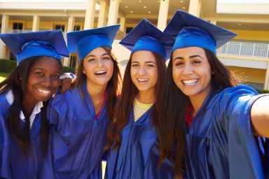 Group Of Female High School Students Celebrating Graduation