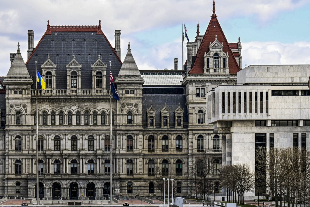 FILE - A partial views of the New York state Capitol building, left, is shown next to the state Appellate court building in foreground, right, Monday, April 4, 2022, in Albany, N.Y. A panel of five mid-level New York appellate judges have ruled on Thursday, April 21, 2022 that state Democrats engaged in gerrymandering when drawing new congressional district boundaries for the next decade.