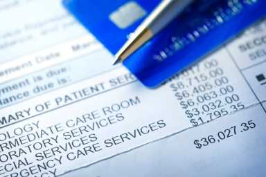 GettyImages-1049802688_hospital-bill_1350