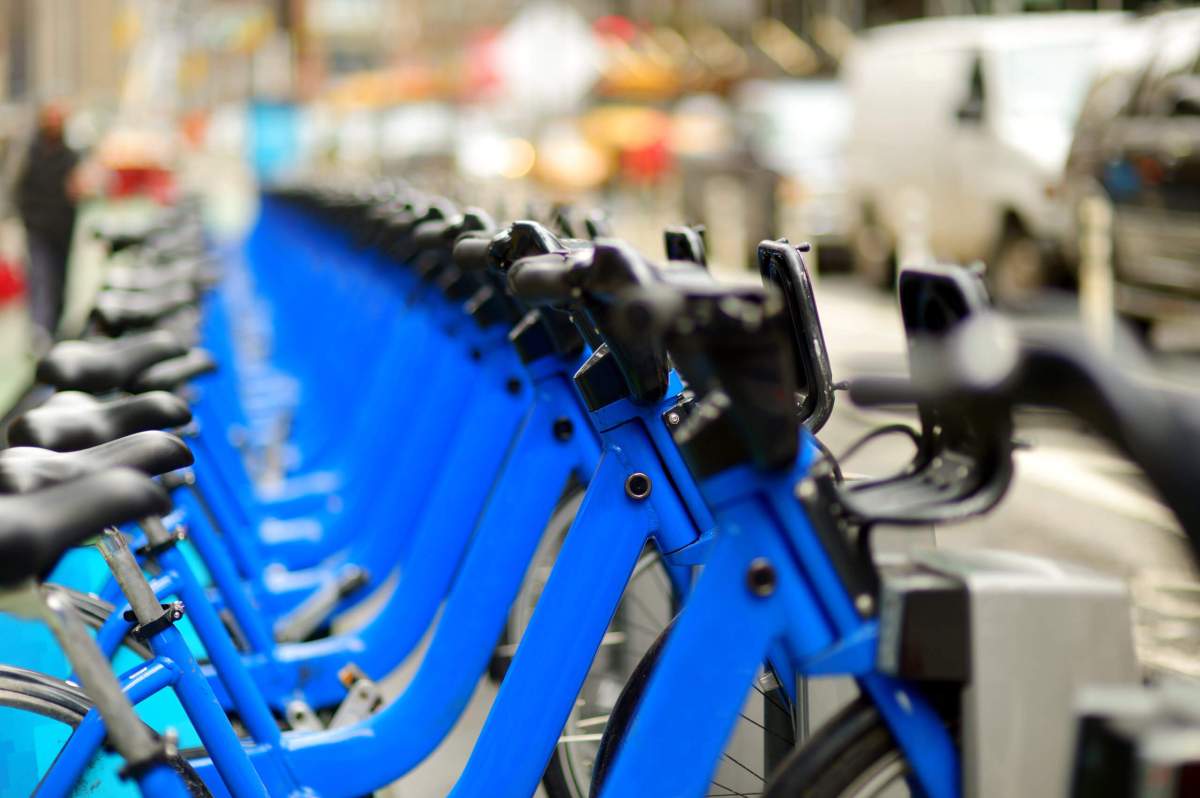 Row of city bikes for rent at docking stations in New York