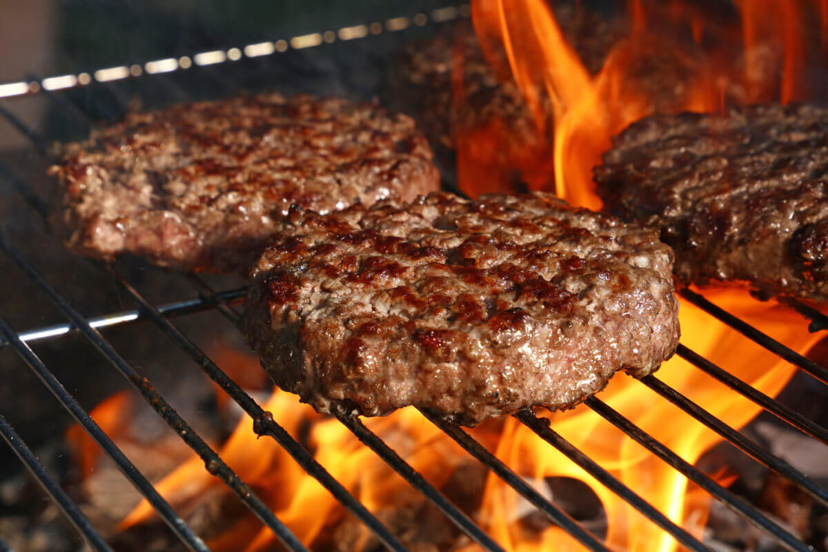 Beef burger for hamburger on barbecue flame grill