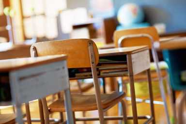 Classroom with empty wooden desks