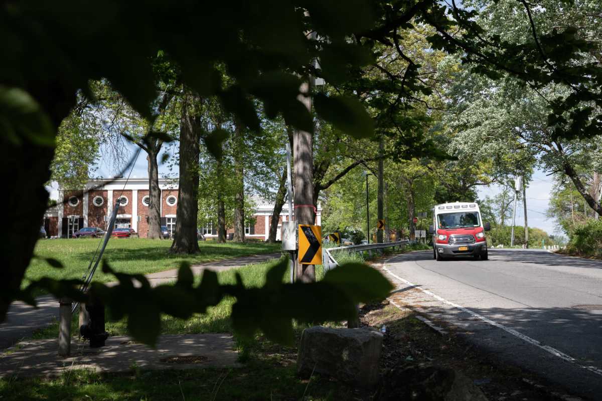 Two individuals were found dead in a burning car near the Pelham Bay and Split Rock Golf Courses on May 16, 2022. Pictured, an EMS vehicle drives by the golf course on May 17, 2022.