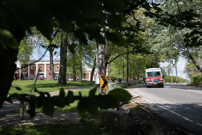 Two individuals were found dead in a burning car near the Pelham Bay and Split Rock Golf Courses on May 16, 2022. Pictured, an EMS vehicle drives by the golf course on May 17, 2022.