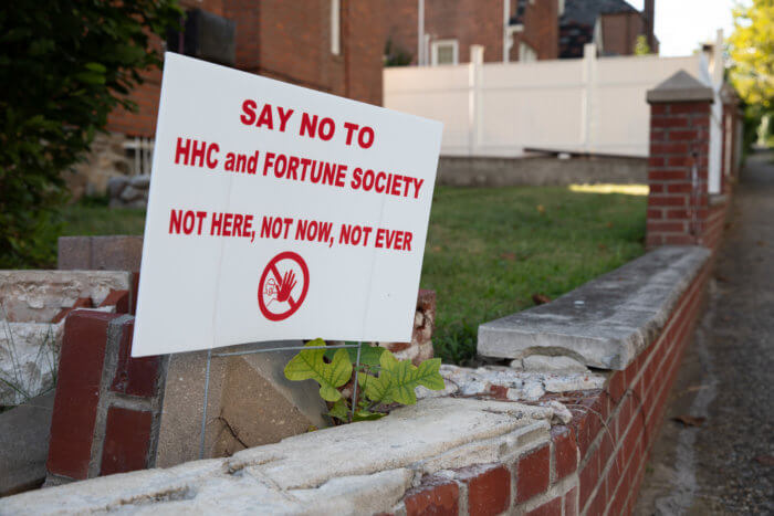 a sign that says "Say no to HHC and the Fortune Society. Not Here, not now, not ever"