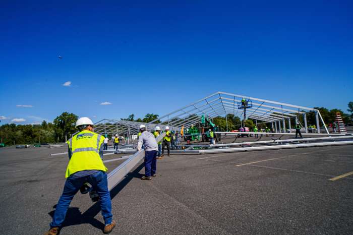 Construction on a humanitarian relief center for asylum seekers begins on Tuesday, Sept. 27 at Orchard Beach in the Bronx.