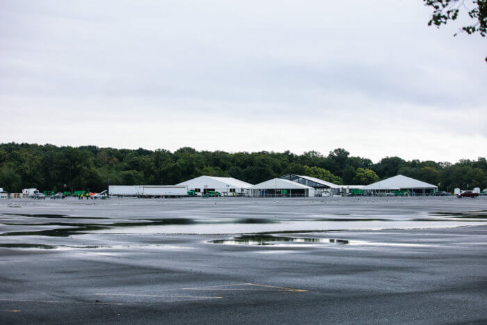 Rain comes down on the Orchard Beach migrant shelter on Saturday, Oct. 1, 2022.