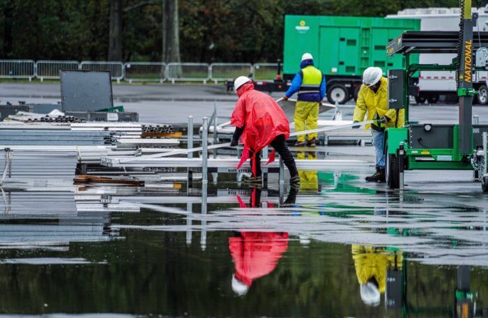 Rain floods the Orchard Beach migrant shelter.