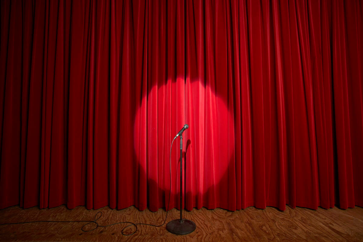 Spotlight on microphone stand on stage